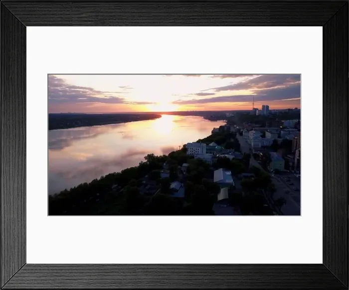 Framed Print : Flying above the city and a temple with golden dome located by the river Framed Print : Flying above the city and a temple with golden dome located by the river