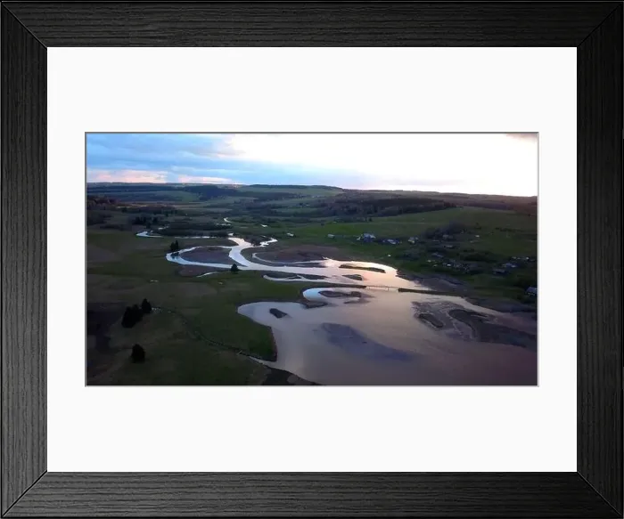 Framed Print : Aerial view of a swampy terrain on a sunset sky background. Clip. Bending river and fields Framed Print : Aerial view of a swampy terrain on a sunset sky background. Clip. Bending river and fields