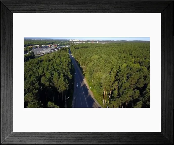 Framed Print : Aerial view of cars travelling in beautiful forested terrain Framed Print : Aerial view of cars travelling in beautiful forested terrain