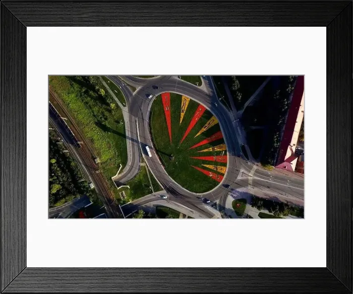 Framed Print : Aerial view of a round shaped crossroad with moving cars Framed Print : Aerial view of a round shaped crossroad with moving cars