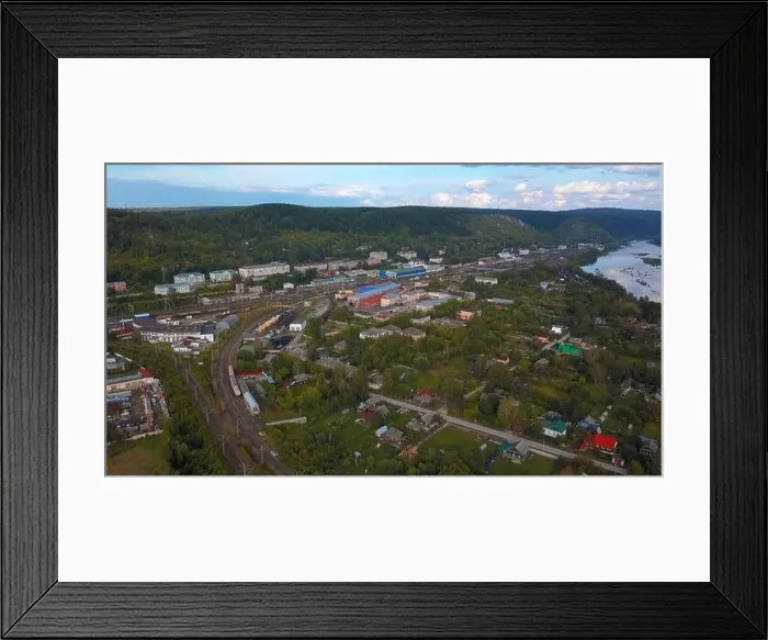 Framed Print : Aerial view of the bending railroad, Clip. Small town on a blue sky background, concept of logistics and transportation Framed Print : Aerial view of the bending railroad, Clip. Small town on a blue sky background, concept of logistics and transportation
