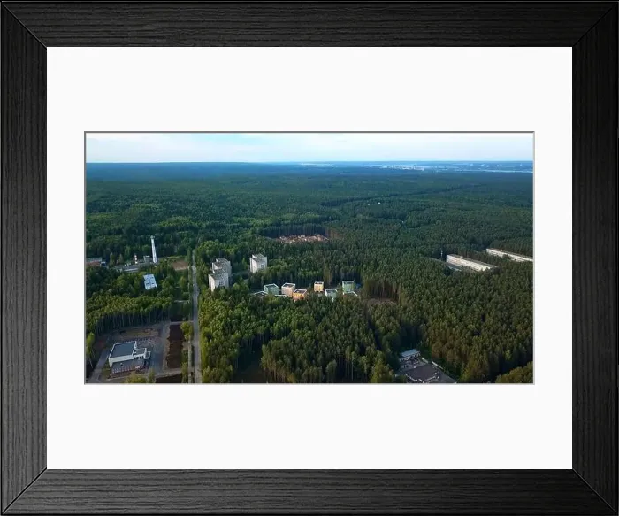 Framed Print : Aerial view of industrial buildings at the suburb of the city, next to forest and nature. Clip Industrial zone of a city Framed Print : Aerial view of industrial buildings at the suburb of the city, next to forest and nature. Clip Industrial zone of a city