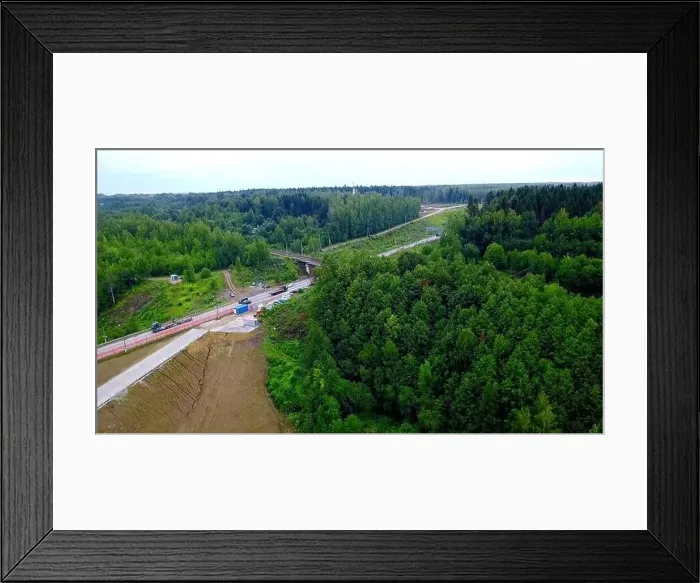 Framed Print : Aerial view of cars travelling in beautiful forested terrain Framed Print : Aerial view of cars travelling in beautiful forested terrain