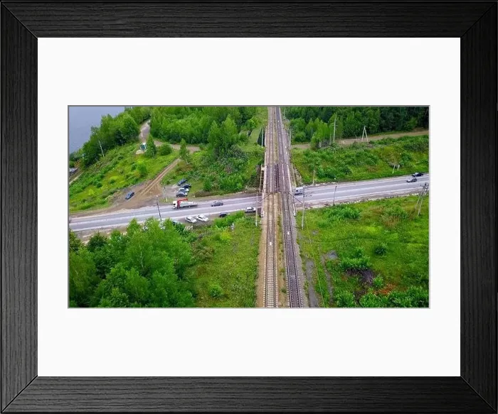 Framed Print : Aerial view of the concrete road leading to the industrial zone. Clip. Cars driving near green summer trees Framed Print : Aerial view of the concrete road leading to the industrial zone. Clip. Cars driving near green summer trees