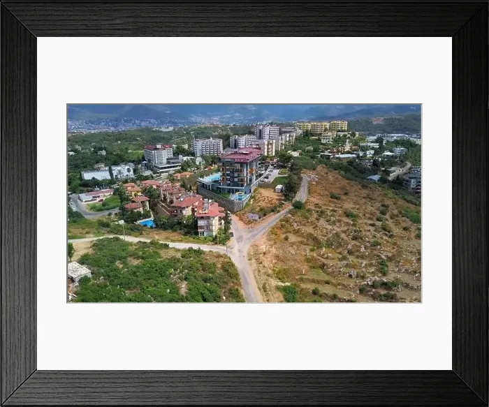 Framed Print : Picturesque summer city with many houses among greenery. Clip. Buildings and vegetation under the shining sun Framed Print : Picturesque summer city with many houses among greenery. Clip. Buildings and vegetation under the shining sun