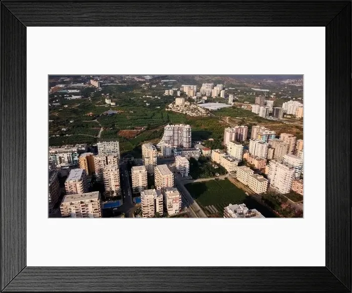 Framed Print : Aerial view of a city with many woman. Clip. Summer green city in a morning haze Framed Print : Aerial view of a city with many woman. Clip. Summer green city in a morning haze