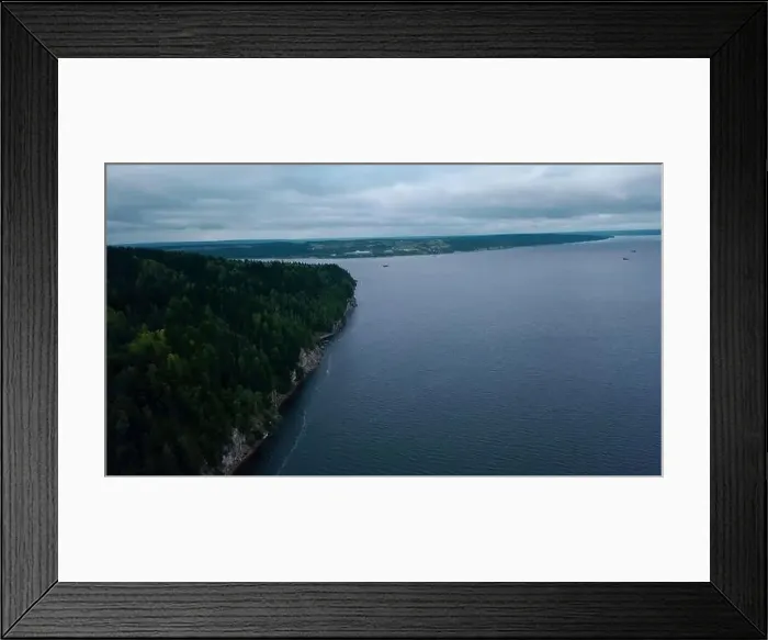 Framed Print : Aerial view of a forested cliff and the large blue lake. Clip. Amazing water reservoir and green hills Framed Print : Aerial view of a forested cliff and the large blue lake. Clip. Amazing water reservoir and green hills