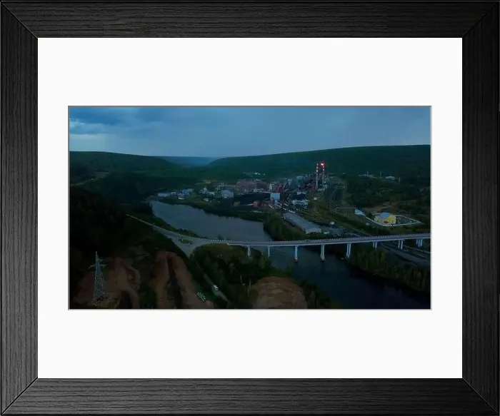 Framed Print : Flying above the river through small town and mountain landscape. Clip. Bridge across the wide river leading to the town Framed Print : Flying above the river through small town and mountain landscape. Clip. Bridge across the wide river leading to the town