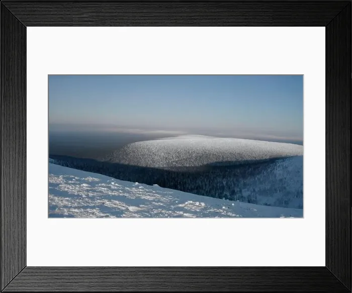 Framed Print : Calm and cold landscape with the endless valley of frozen forest. Clip. Aerial view of a snow covered mountain Framed Print : Calm and cold landscape with the endless valley of frozen forest. Clip. Aerial view of a snow covered mountain