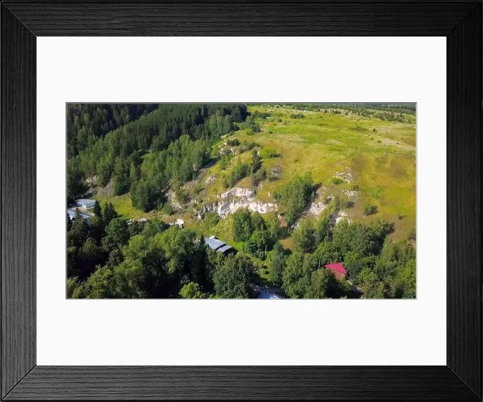 Framed Print : Aerial view of a rock cliff and pine trees. Clip. Flying above green meadows and stone formations Framed Print : Aerial view of a rock cliff and pine trees. Clip. Flying above green meadows and stone formations