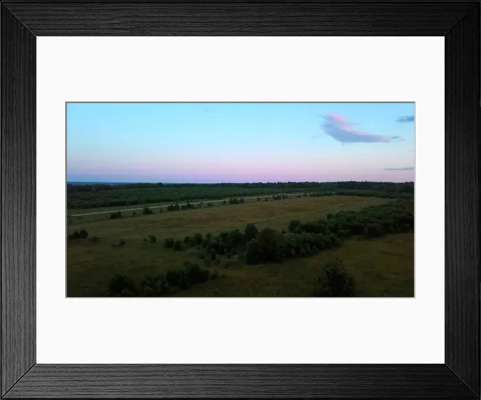 Framed Print : Aerial view and a sunset over meadow. Clip. Beautiful green fields and warm sunset sunlight
