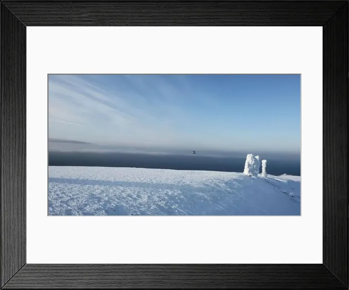 Framed Print : Aerial view over snow covered stone blocks and white valley. Clip. Manpupuner in winter on a blue sky background
