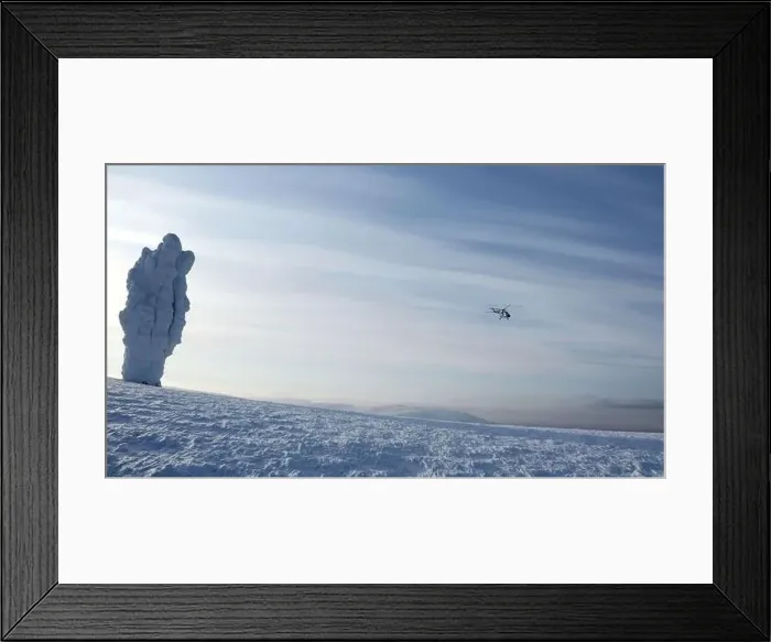 Framed Print : Helicopter flying above snow covered forest on a blue ske background. Clip. Natural frosty winter background