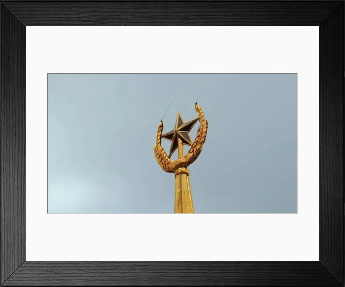 Framed Print : Soviet symbol, golden spire on a cloudy sky background. Stock footage. Golden star and ears of wheat Framed Print : Soviet symbol, golden spire on a cloudy sky background. Stock footage. Golden star and ears of wheat