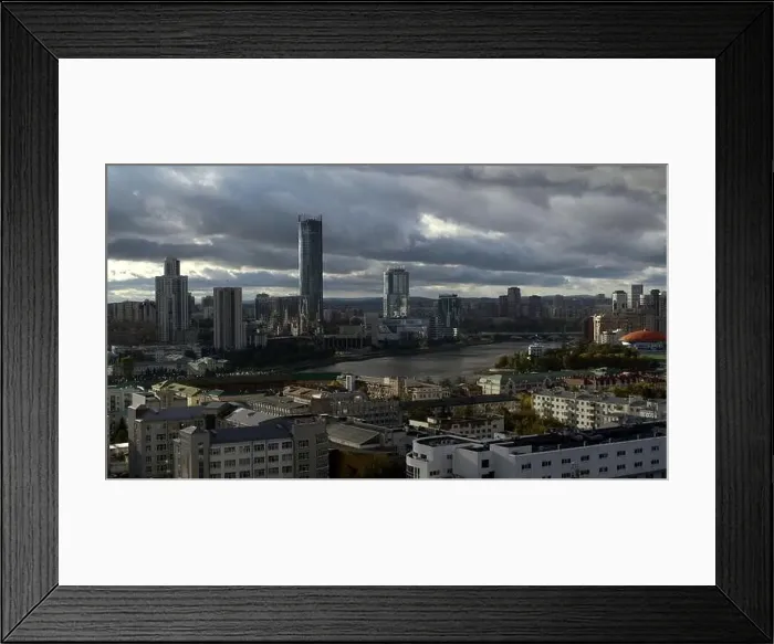 Framed Print : Aerial view of a city center on a cloudy sky background Framed Print : Aerial view of a city center on a cloudy sky background