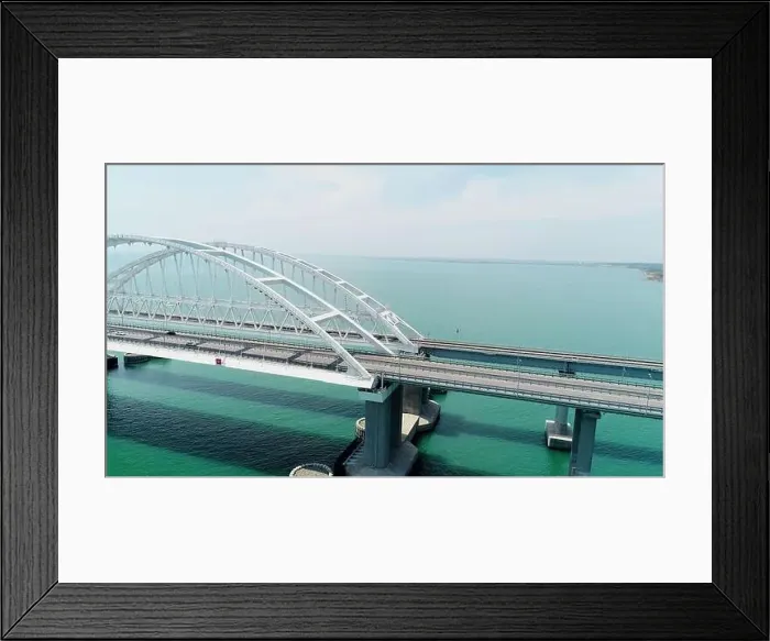 Framed Print : Aerial breathtaking view of the turquoise sea and a long white bridge with arcuate shape Framed Print : Aerial breathtaking view of the turquoise sea and a long white bridge with arcuate shape