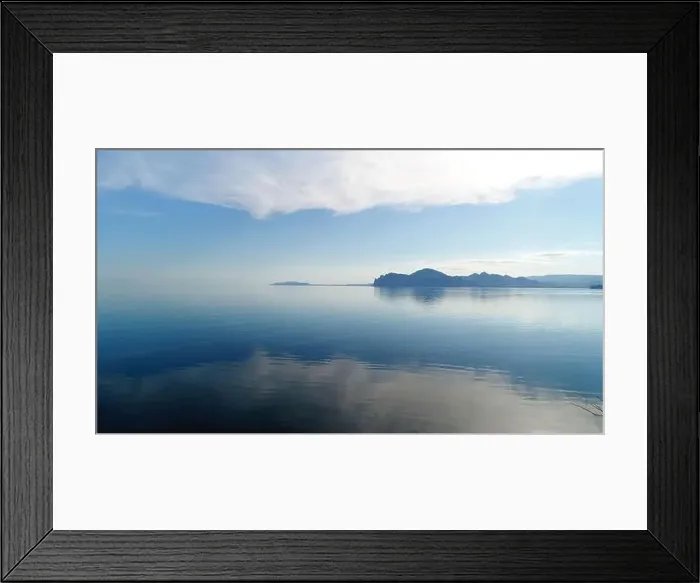 Framed Print : Stunning view from the meadow on calm dark blue water surface. Shot. Blue sky reflected in lake calm water Framed Print : Stunning view from the meadow on calm dark blue water surface. Shot. Blue sky reflected in lake calm water