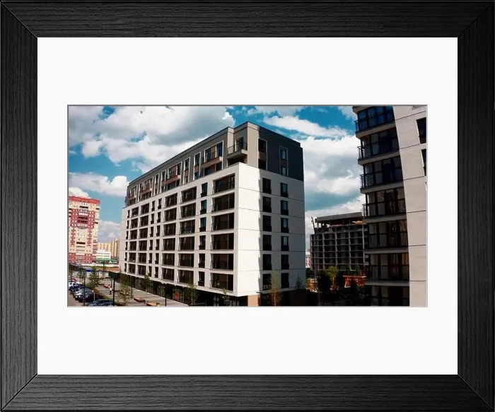 Framed Print : Aerial view of a high residential building of a newly built city aeria. Stock footage. Concept of urbanization Framed Print : Aerial view of a high residential building of a newly built city aeria. Stock footage. Concept of urbanization