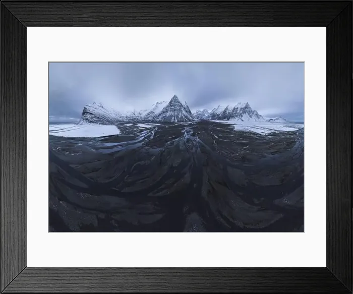 Framed Print : From above aerial view of river estuary covered with ice in snowy valley of mountains in winter time in Iceland Framed Print : From above aerial view of river estuary covered with ice in snowy valley of mountains in winter time in Iceland
