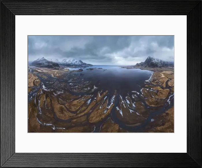 Framed Print : From above aerial view of river estuary and ocean coast near mountain peaks covered with snow in winter time in Iceland Framed Print : From above aerial view of river estuary and ocean coast near mountain peaks covered with snow in winter time in Iceland