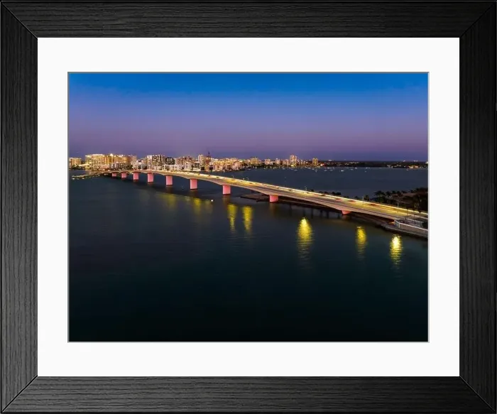 Framed Print : Evening aerial image of the Sarasota, Florida Skyline and Bridge Across Sarasota Bay Framed Print : Evening aerial image of the Sarasota, Florida Skyline and Bridge Across Sarasota Bay