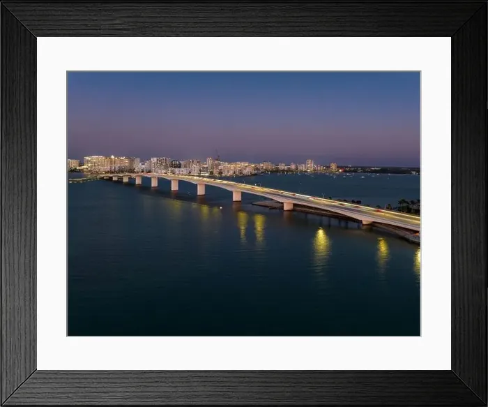 Framed Print : Evening aerial image of the Sarasota, Florida Skyline and Bridge Across Sarasota Bay Framed Print : Evening aerial image of the Sarasota, Florida Skyline and Bridge Across Sarasota Bay