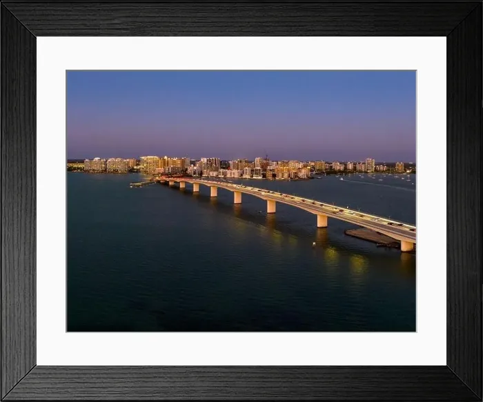 Framed Print : Evening aerial image of the Sarasota, Florida Skyline and Bridge Across Sarasota Bay Framed Print : Evening aerial image of the Sarasota, Florida Skyline and Bridge Across Sarasota Bay