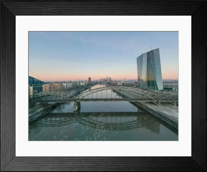 Framed Print : Aerial panoramic picture of Deutschherrnbrücke with Frankfurt skyline during sunrise in winter Framed Print : Aerial panoramic picture of Deutschherrnbrücke with Frankfurt skyline during sunrise in winter