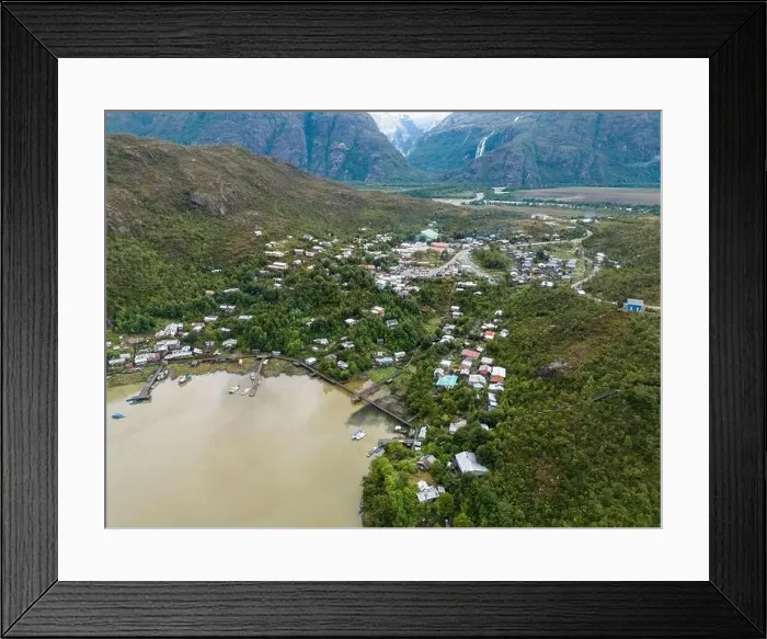 Framed Print : Drone view of Caleta Tortel with its small cabins - Discovering the beautiful village while traveling the Carretera Framed Print : Drone view of Caleta Tortel with its small cabins - Discovering the beautiful village while traveling the Carretera