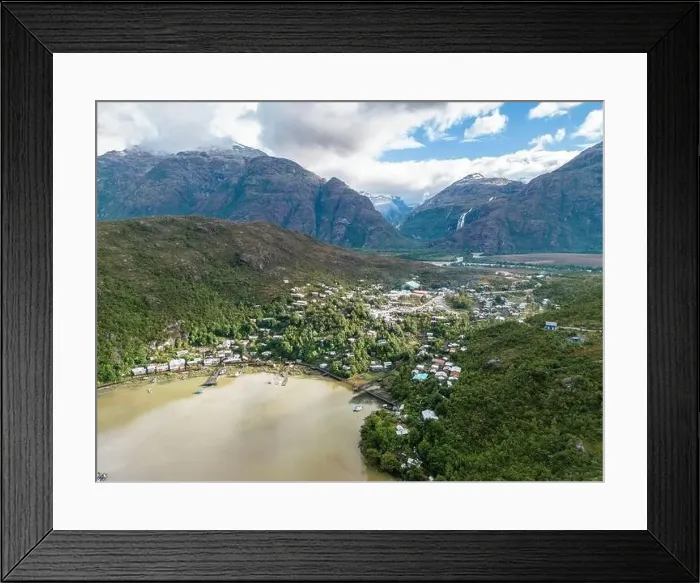 Framed Print : Drone view of Caleta Tortel with its small cabins - Discovering the beautiful village while traveling the Carretera Framed Print : Drone view of Caleta Tortel with its small cabins - Discovering the beautiful village while traveling the Carretera