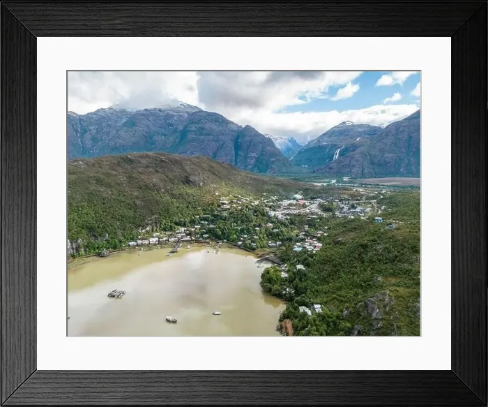 Framed Print : Drone view of Caleta Tortel with its small cabins - Discovering the beautiful village while traveling the Carretera Framed Print : Drone view of Caleta Tortel with its small cabins - Discovering the beautiful village while traveling the Carretera
