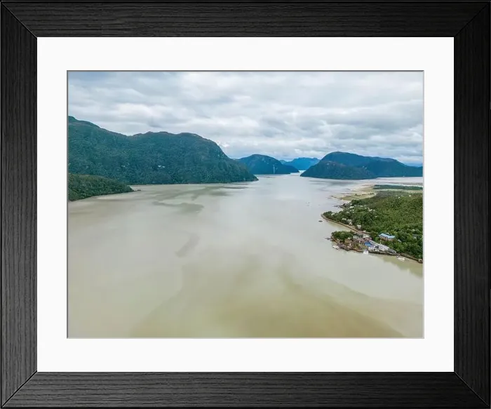 Framed Print : Drone view of Caleta Tortel with its small cabins - Discovering the beautiful village while traveling the Carretera Framed Print : Drone view of Caleta Tortel with its small cabins - Discovering the beautiful village while traveling the Carretera