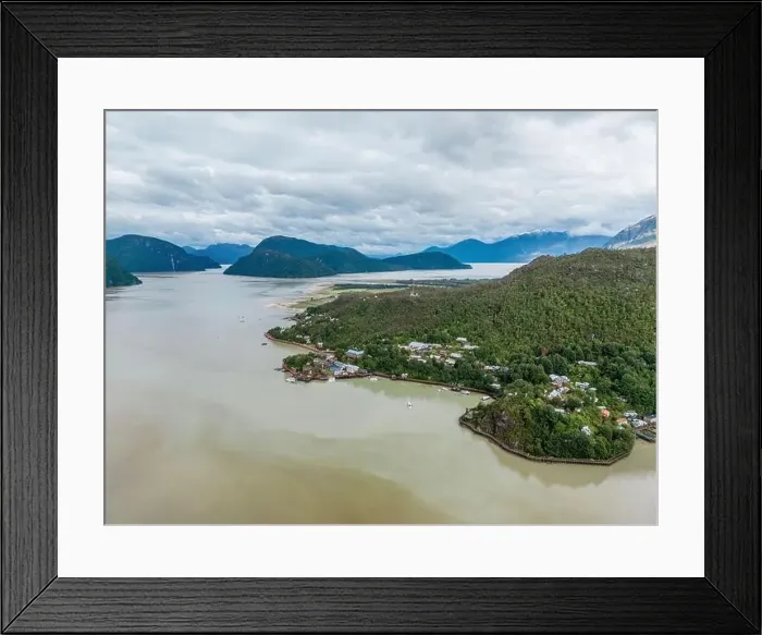 Framed Print : Drone view of Caleta Tortel with its small cabins - Discovering the beautiful village while traveling the Carretera Framed Print : Drone view of Caleta Tortel with its small cabins - Discovering the beautiful village while traveling the Carretera