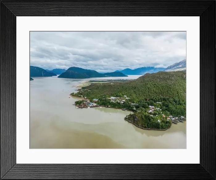 Framed Print : Drone view of Caleta Tortel with its small cabins - Discovering the beautiful village while traveling the Carretera Framed Print : Drone view of Caleta Tortel with its small cabins - Discovering the beautiful village while traveling the Carretera