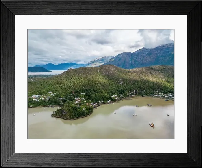 Framed Print : Drone view of Caleta Tortel with its small cabins - Discovering the beautiful village while traveling the Carretera Framed Print : Drone view of Caleta Tortel with its small cabins - Discovering the beautiful village while traveling the Carretera