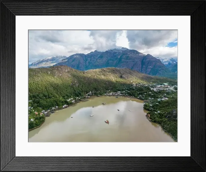 Framed Print : Drone view of Caleta Tortel with its small cabins - Discovering the beautiful village while traveling the Carretera Framed Print : Drone view of Caleta Tortel with its small cabins - Discovering the beautiful village while traveling the Carretera