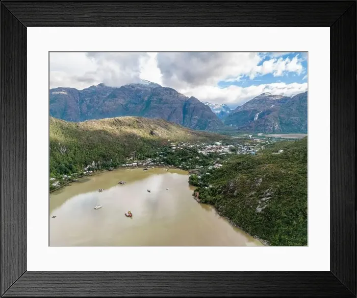 Framed Print : Drone view of Caleta Tortel with its small cabins - Discovering the beautiful village while traveling the Carretera Framed Print : Drone view of Caleta Tortel with its small cabins - Discovering the beautiful village while traveling the Carretera