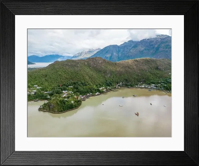 Framed Print : Drone view of Caleta Tortel with its small cabins - Discovering the beautiful village while traveling the Carretera Framed Print : Drone view of Caleta Tortel with its small cabins - Discovering the beautiful village while traveling the Carretera