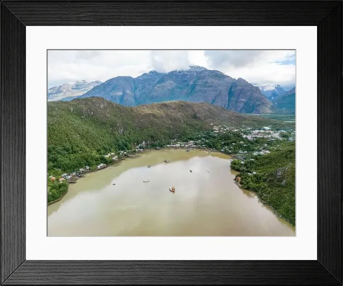 Framed Print : Drone view of Caleta Tortel with its small cabins - Discovering the beautiful village while traveling the Carretera Framed Print : Drone view of Caleta Tortel with its small cabins - Discovering the beautiful village while traveling the Carretera