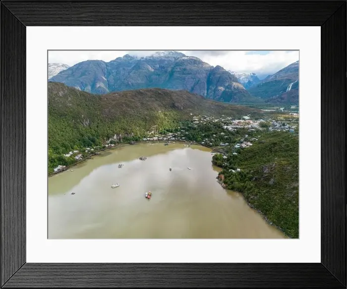 Framed Print : Drone view of Caleta Tortel with its small cabins - Discovering the beautiful village while traveling the Carretera Framed Print : Drone view of Caleta Tortel with its small cabins - Discovering the beautiful village while traveling the Carretera