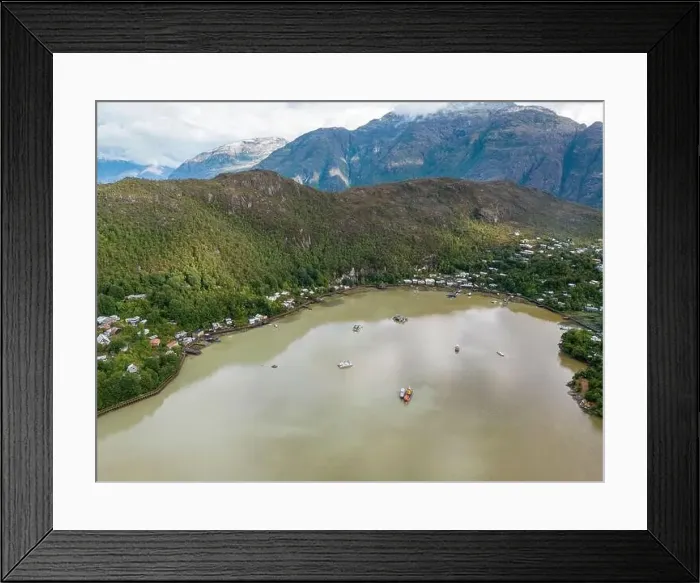 Framed Print : Drone view of Caleta Tortel with its small cabins - Discovering the beautiful village while traveling the Carretera Framed Print : Drone view of Caleta Tortel with its small cabins - Discovering the beautiful village while traveling the Carretera