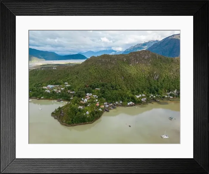 Framed Print : Drone view of Caleta Tortel with its small cabins - Discovering the beautiful village while traveling the Carretera