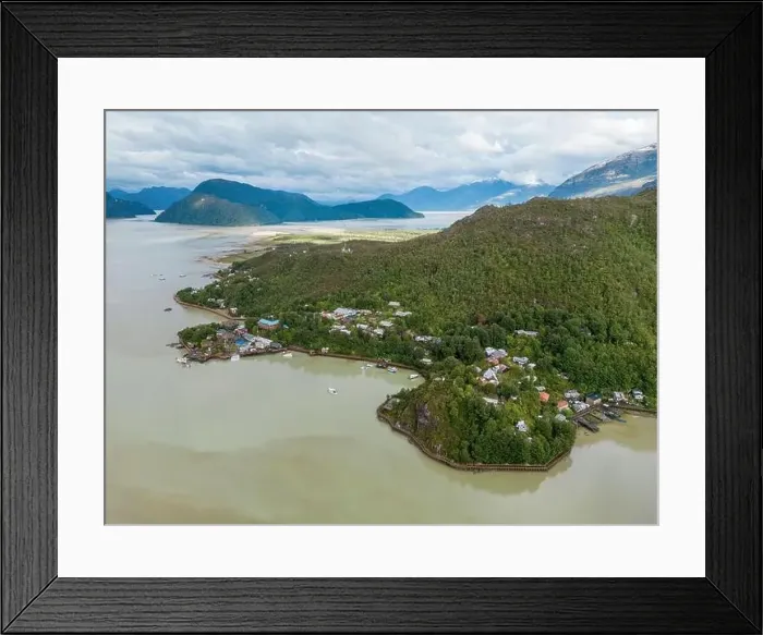 Framed Print : Drone view of Caleta Tortel with its small cabins - Discovering the beautiful village while traveling the Carretera Framed Print : Drone view of Caleta Tortel with its small cabins - Discovering the beautiful village while traveling the Carretera