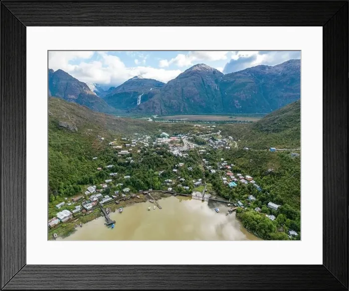 Framed Print : Drone view of Caleta Tortel with its small cabins - Discovering the beautiful village while traveling the Carretera Framed Print : Drone view of Caleta Tortel with its small cabins - Discovering the beautiful village while traveling the Carretera