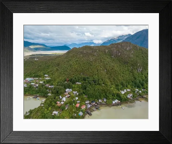 Framed Print : Drone view of Caleta Tortel with its small cabins - Discovering the beautiful village while traveling the Carretera Framed Print : Drone view of Caleta Tortel with its small cabins - Discovering the beautiful village while traveling the Carretera