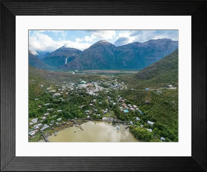Framed Print : Drone view of Caleta Tortel with its small cabins - Discovering the beautiful village while traveling the Carretera Framed Print : Drone view of Caleta Tortel with its small cabins - Discovering the beautiful village while traveling the Carretera