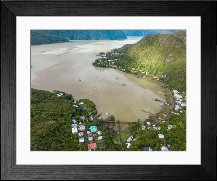 Framed Print : Drone view of Caleta Tortel with its small cabins - Discovering the beautiful village while traveling the Carretera Framed Print : Drone view of Caleta Tortel with its small cabins - Discovering the beautiful village while traveling the Carretera