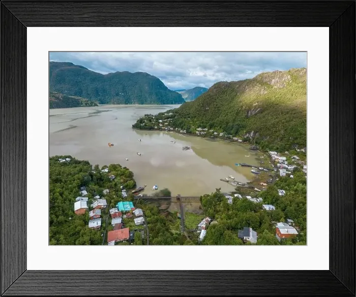 Framed Print : Drone view of Caleta Tortel with its small cabins - Discovering the beautiful village while traveling the Carretera Framed Print : Drone view of Caleta Tortel with its small cabins - Discovering the beautiful village while traveling the Carretera