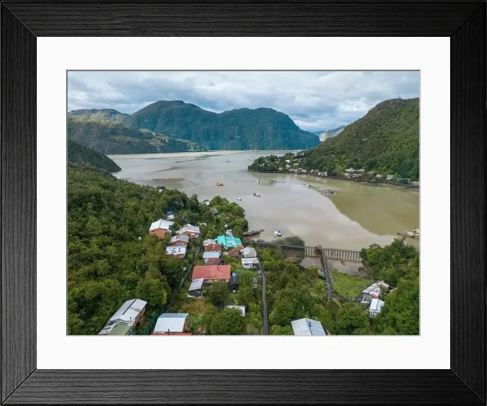 Framed Print : Drone view of Caleta Tortel with its small cabins - Discovering the beautiful village while traveling the Carretera Framed Print : Drone view of Caleta Tortel with its small cabins - Discovering the beautiful village while traveling the Carretera