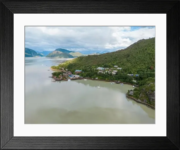 Framed Print : Drone view of Caleta Tortel with its small cabins - Discovering the beautiful village while traveling the Carretera Framed Print : Drone view of Caleta Tortel with its small cabins - Discovering the beautiful village while traveling the Carretera